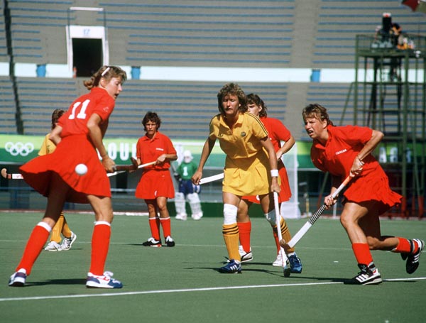 Canada's Michelle Conn (#11) and Liz Czenczek (right) play field hockey at the 1988 Seoul Olympic Games. (CP Photo/ COA/ T. Grant)
