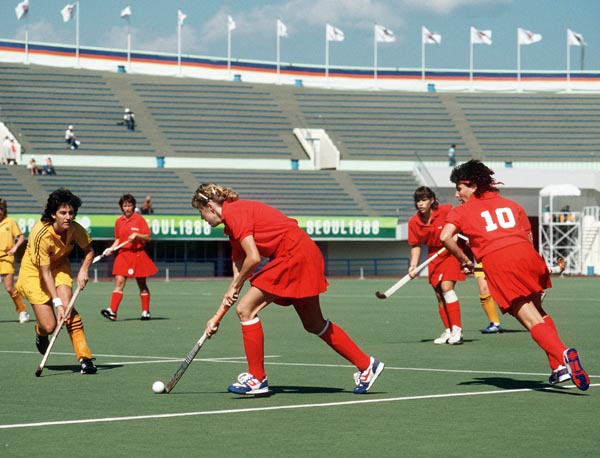 Canada's Michelle Conn (left) and Shona Schleppe (#10) play field hockey at the 1988 Seoul Olympic Games. (CP Photo/ COA/ T. Grant)