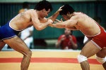 Canada's Chris Rinke (blue) competing in the wrestling event at the 1988 Olympic games in Seoul. (CP PHOTO/ COA/ Cromby McNeil)