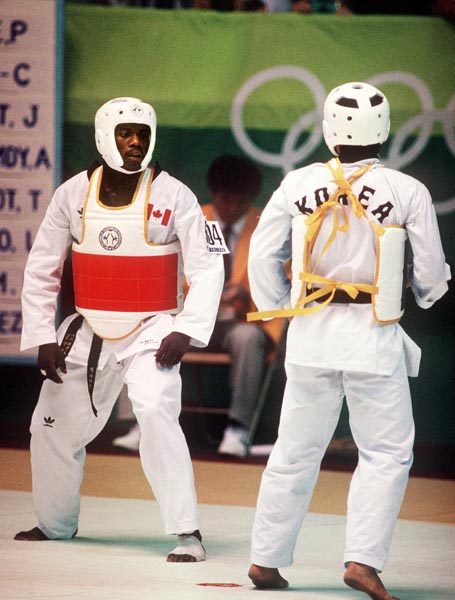 Canada's Albert Smythe (left) competes in the taekwondo event at the 1988 Seoul Olympic Games. (CP PHOTO/COA/ T. Grant)