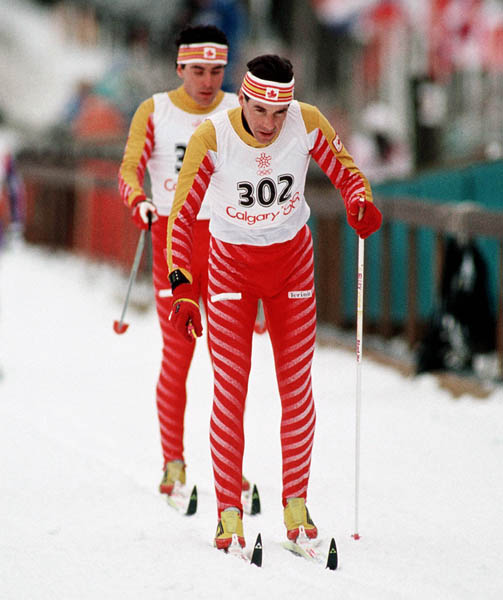 Canada's Pierre Harvey (front) competes in a cross country ski event at the 1988 Calgary Olympic winter Games. (CP PHOTO/COA/ J. Gibson)