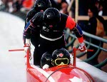 (From left to right) Canada's Greg Haydenluck, Cal Langford, Kevin Tyler and Lloyd Guss compete in the four man bobsleigh event at the 1988 Calgary Winter Olympics. (CP PHOTO/ COA/ T. O'lett)