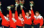 (From left to right) Canada's Linda Moore, Lindsay Sparkes (hidden), Debbie Jones, Penny Ryan and Patti Vandekerckhove celebrate their gold medal win in the women's curling event at the 1988 Calgary Olympic winter Games. (CP PHOTO/COA/Ted Grant)