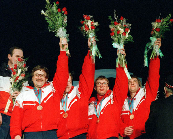 (From left to right) Canada's Edward Lukowich, John Ferguson, Neil Houston and Brent Syme celebrate their bronze medal win in the men's curling event at the 1988 Calgary Olympic winter Games. (CP PHOTO/COA/Ted Grant)