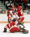 Canada's Marc Habscheid (#14) Timothy Walters (#2) and Sean Burke (#1) participate in the hockey event at the 1988 Winter Olympics in Calgary. (CP PHOTO/ COA/ S.Grant)