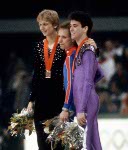 USA's Scott Hamilton (centre) and Brian Orser (right) celebrate after winning gold and silver medals in the figure skating event at the 1984 Sarajevo Winter Olympic Games.(CP Photo/ COA/ Crombie McNeil)