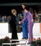 USA's Scott Hamilton (centre) and Brian Orser (right) celebrate after winning gold and silver medals in the figure skating event at the 1984 Sarajevo Winter Olympic Games.(CP Photo/ COA/ Crombie McNeil)