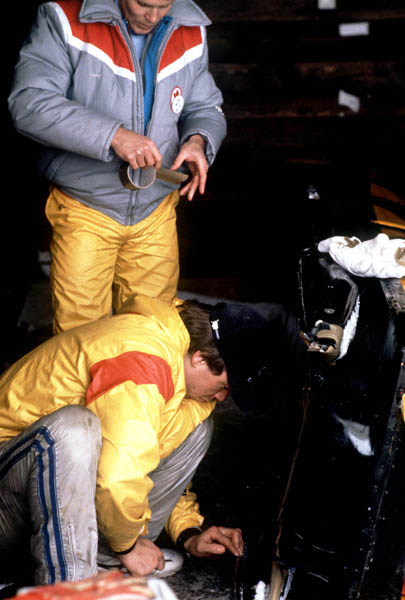 Canada's Jack Addison and Dana Rice make adjustments to their bobsleigh in the two man event at the 1984 Sarajevo Winter Olympics. (CP PHOTO/ COA/ Tim O'lett)