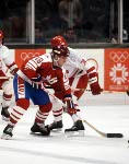 Canada's Dave Gagner (19) looks towards teammate Russ Courtnall (foreground) during hockey action against Sweden at the 1984 Winter Olympics in Sarajevo. (CP PHOTO/ COA/O. Bierwagon )