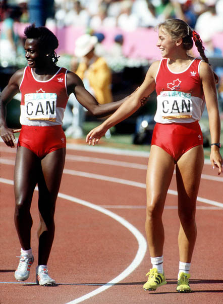 Canada's Angela Bailey (left) and France Gareau exchange words during an athletics event at the 1984 Olympic games in Los Angeles. (CP PHOTO/ COA/JM)