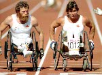 Canada's Rick Hansen (left) and Andre Viger  compete in the wheelchair event at the 1984 Olympic games in Los Angeles. (CP PHOTO/ COA/J Merrithew)