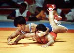 Canada's Ray Takahashi (red) competes in the freestye wrestling event at the 1984 Olympic games in Los Angeles. (CP PHOTO/COA/Crombie McNeil)