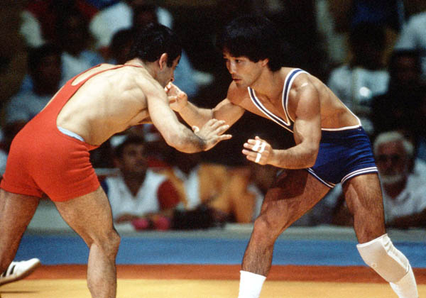 Canada's Ray Takahashi (blue) competes in the wrestling event at the 1984 Olympic games in Los Angeles. (CP PHOTO/COA/Crombie McNeil)