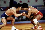 Canada's Ray Takahashi (red) competes in the freestye wrestling event at the 1984 Olympic games in Los Angeles. (CP PHOTO/COA/Crombie McNeil)