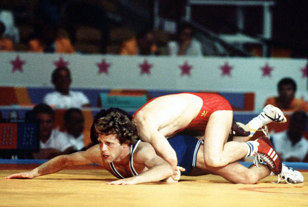 Canada's Doug Yeats (blue) competes in the Greco Roman wrestling event at the 1984 Olympic games in Los Angeles. (CP PHOTO/COA/Crombie McNeil)
