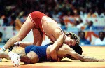 Canada's Doug Yeats (red) competes in the Greco Roman wrestling event at the 1984 Olympic games in Los Angeles. (CP PHOTO/COA/Crombie McNeil)