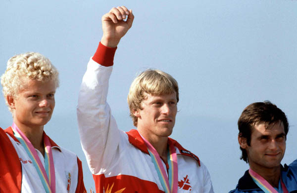 Canada's Larry Cain (centre) celebrates a gold medal win in the  men's canoe event at the 1984 Olympic games in Los Angeles. (CP PHOTO/ COA/)