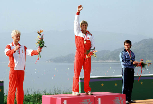 Canada's Larry Cain (middle) celebrates a gold medal win in the  men's canoe event at the 1984 Olympic games in Los Angeles. (CP PHOTO/ COA/)