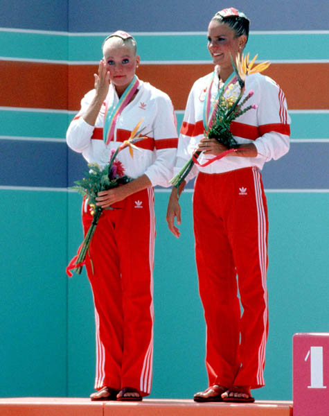 Canada's Kelly Kryczka (right) and Sharon Hambrook celebrate a silver medal win in the synchronized swimming event at the 1984 Olympic games in Los Angeles. (CP PHOTO/ COA/Tim O'lett)