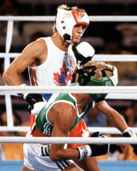 Canada's Steve Pagendam (behind) competes in the boxing event at the 1984 Olympic games in Los Angeles. (CP PHOTO/ COA/ Tim O'lett)
