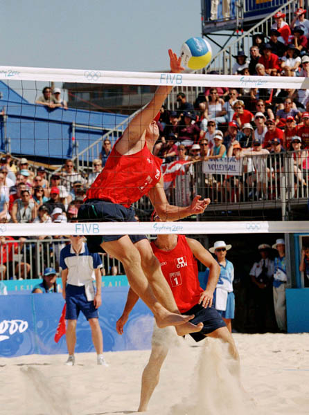 Canada's Mark Heese (left) and John Child play a set of beach volleyball at the 2000 Sydney Olympic Games. (CP Photo/ COA)
