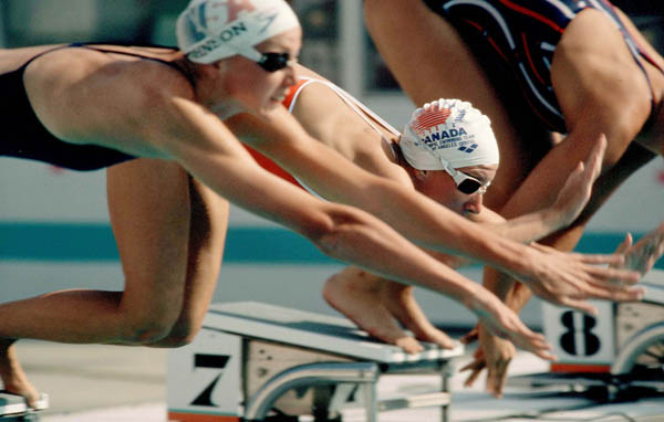 Canada's Michelle MacPherson (centre) competes in the swimming event at the 1984 Olympic games in Los Angeles. (CP PHOTO/ COA/Ted Grant )