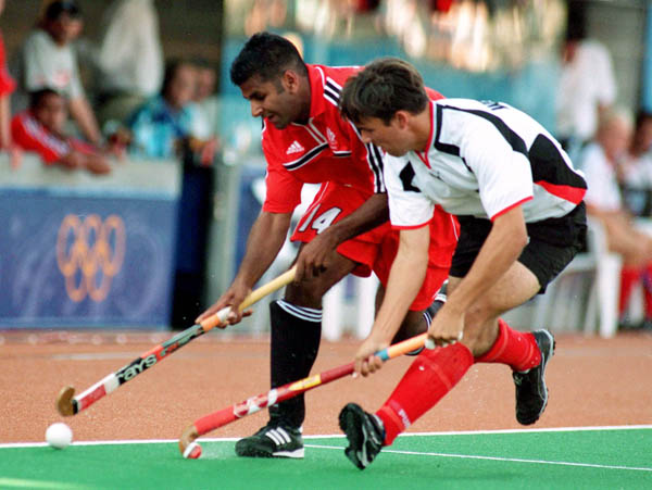 Canada's Ronnie Jagday (left) participates in field hockey action at the 2000 Sydney Olympic Games. (CP Photo/ COA)