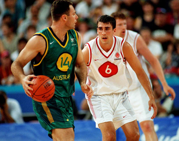 Canada's Andrew Mavis (right) guards an Australian opponent during basketball action at the 2000 Sydney Olympic Games. (CP Photo/ COA)