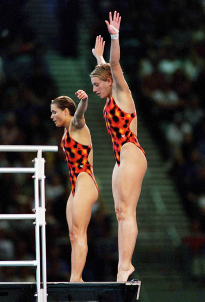 Canada's Emilie Heymans and Anne Montminy perform a well timed synchronized dive at the Sydney 2000 Olympic Games. (CP PHOTO/ COA)