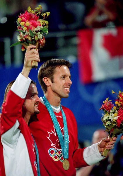 Canada's Sebastien Lareau (left) and Daniel Nestor celebrate their gold medal win in the men's doubles tennis event at the 2000 Sydney Olympic games. (CP PHOTO/ COA)