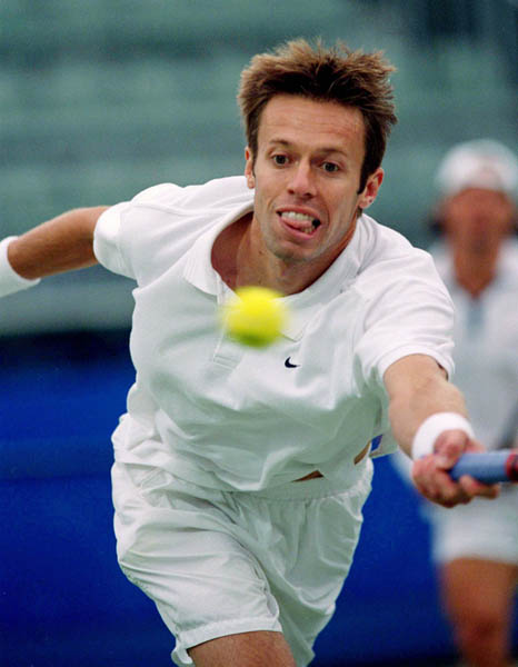 Canada's Daniel Nestor competes in a doubles match during tennis action at the 2000 Sydney Olympic Games. ( Mike Ridewood/CP Photo/ COA)