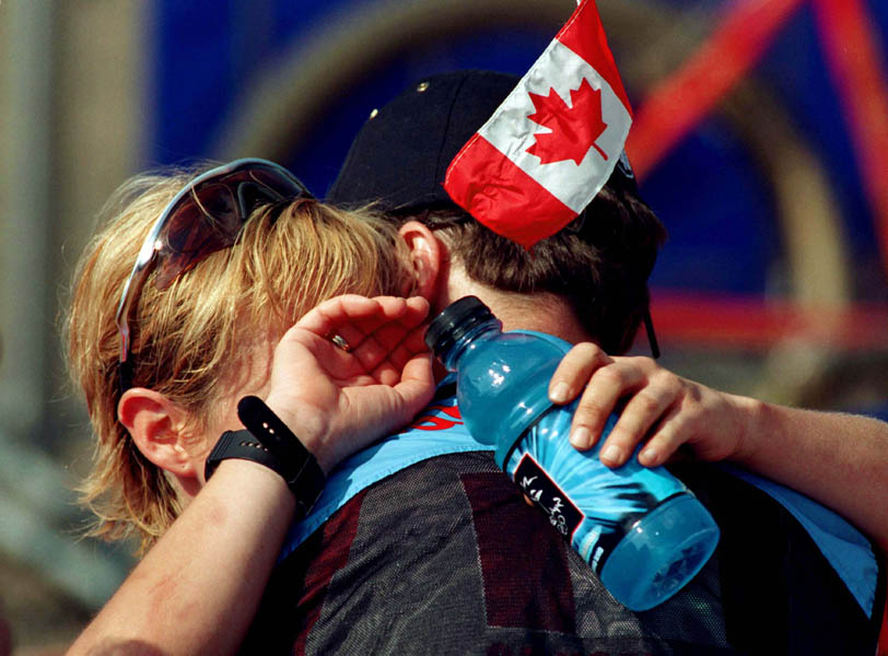Canada's Chrissy Redden (left) gets a hug at the 2000 Sydney Olympic Games. (CP Photo/COA)