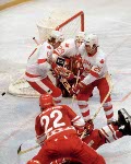 Canada's Jim Nill (12) Ron Davidson (6) and Tim Walters (5) participate in hockey action against the Netherlands at the 1980 Winter Olympics in Lake Placid. (CP PHOTO/ COA/ )