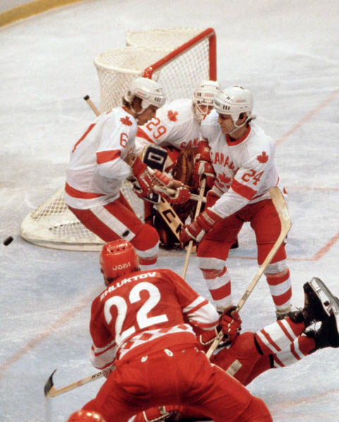 (Left to right) Canada's Ron Davidson, Paul Pageau and Terry O'Mally compete in hockey action against the U.S.S.R. at the 1980 Winter Olympics in Lake Placid. (CP Photo/ COA)
