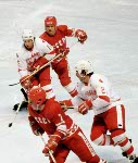Canada's Terry O'Malley (24), John Devaney (15) and Paul Pageau (goalie) compete in hockey action against the U.S.S.R. at the 1980 Winter Olympics in Lake Placid. (CP Photo/ COA)