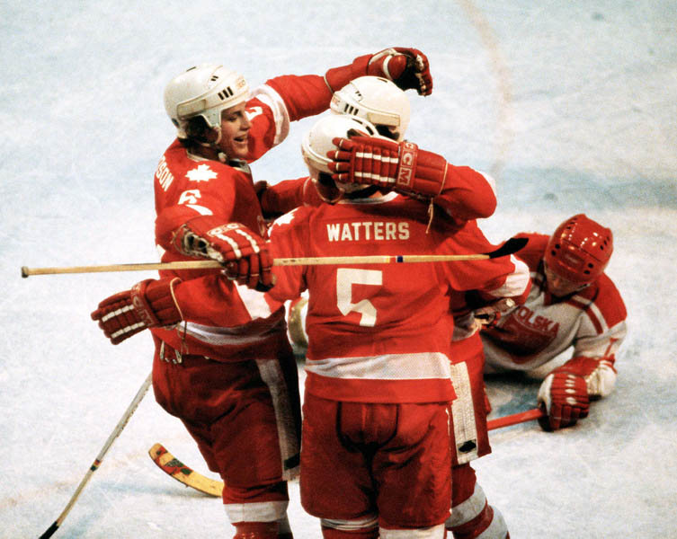 Canada's Tim Watters and Ron Davidson celebrate during in hockey action against Poland at the 1980 Winter Olympics in Lake Placid. (CP Photo/ COA)