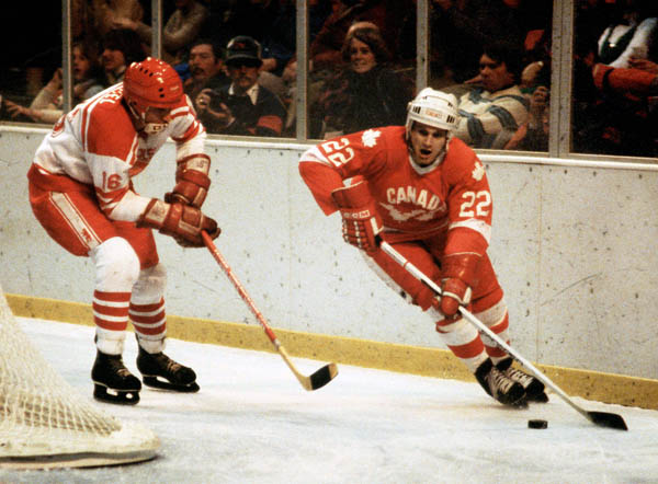 Canada's Stelio Zupancich (right) competes in hockey action at the 1980 Winter Olympics in Lake Placid. (CP Photo/ COA)