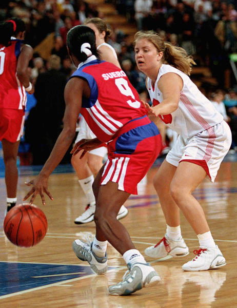 Canada's Teresa Kleindienst (right) tries to block during basketball action at the Sydney 2000 Olympic Games. (CP PHOTO/ COA)