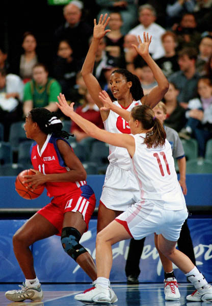 Canada's Tammy Sutton-Brown (centre) and Dianne Norman (#11) defend their zone during basketball action at the Sydney 2000 Olympic Games. (CP PHOTO/ COA)