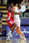 Canada's Dianne Norman (right) covers an opponent during basketball action at the Sydney 2000 Olympic Games. (CP PHOTO/ COA)