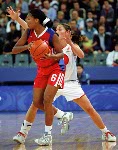 Canada's Dianne Norman (right) covers an opponent during basketball action at the Sydney 2000 Olympic Games. (CP PHOTO/ COA)