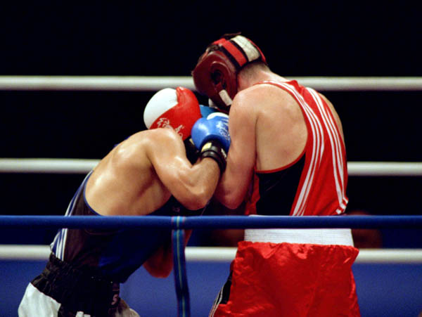 Canada's Mike Strange (right) competes in the boxing event of the 2000 Sydney Olympic Games. (CP Photo/ COA)