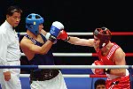 Canada's Artur Binkowski (right) participates in a boxing match at the 2000 Sydney Olympic Games. (CP Photo/ COA)