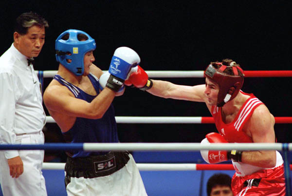 Canada's Mike Strange (right) competes in a boxing match at the 2000 Sydney Olympic Games. (CP Photo/ COA)