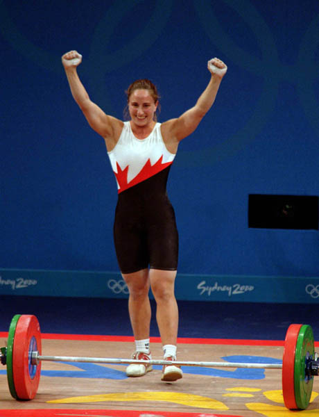 Canada's Maryse Turcotte celebrates a good lift in the women's weightlifting event at the 2000 Sydney Olympic Games. (CP Photo/COA)
