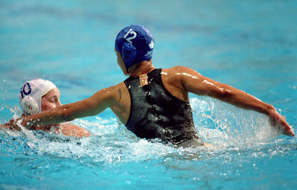 Canada's Waneek Horn-Miller (right) participates in a Women's waterpolo preliminary match at the 2000 Sydney Olympic Games. (CP Photo/COA)
