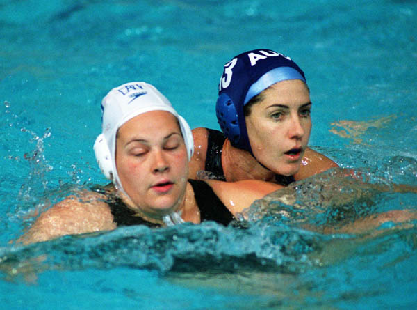 Canada's Sue Gardiner (left) in action during women's waterpolo preliminary action at the 2000 Sydney Olympic Games. (CP Photo/COA)