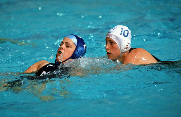 Canada's Jana Salat (right) participates in women's waterpolo preliminary action at the 2000 Sydney Olympic Games. (CP Photo/COA)