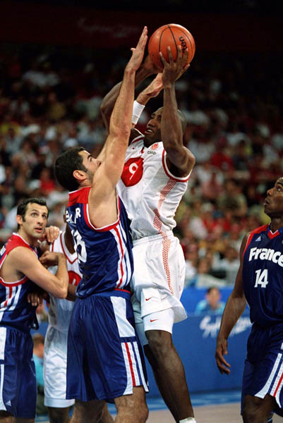 Canada's Rowan Barrett (#9) jumps during basketball action at the 2000 Sydney Olympic Games. (CP Photo/ COA)
