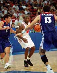 Canada's Greg Francis (left) tries to block an opponent from France during basketball action at the 2000 Sydney Olympic Games. (CP Photo/ COA)
